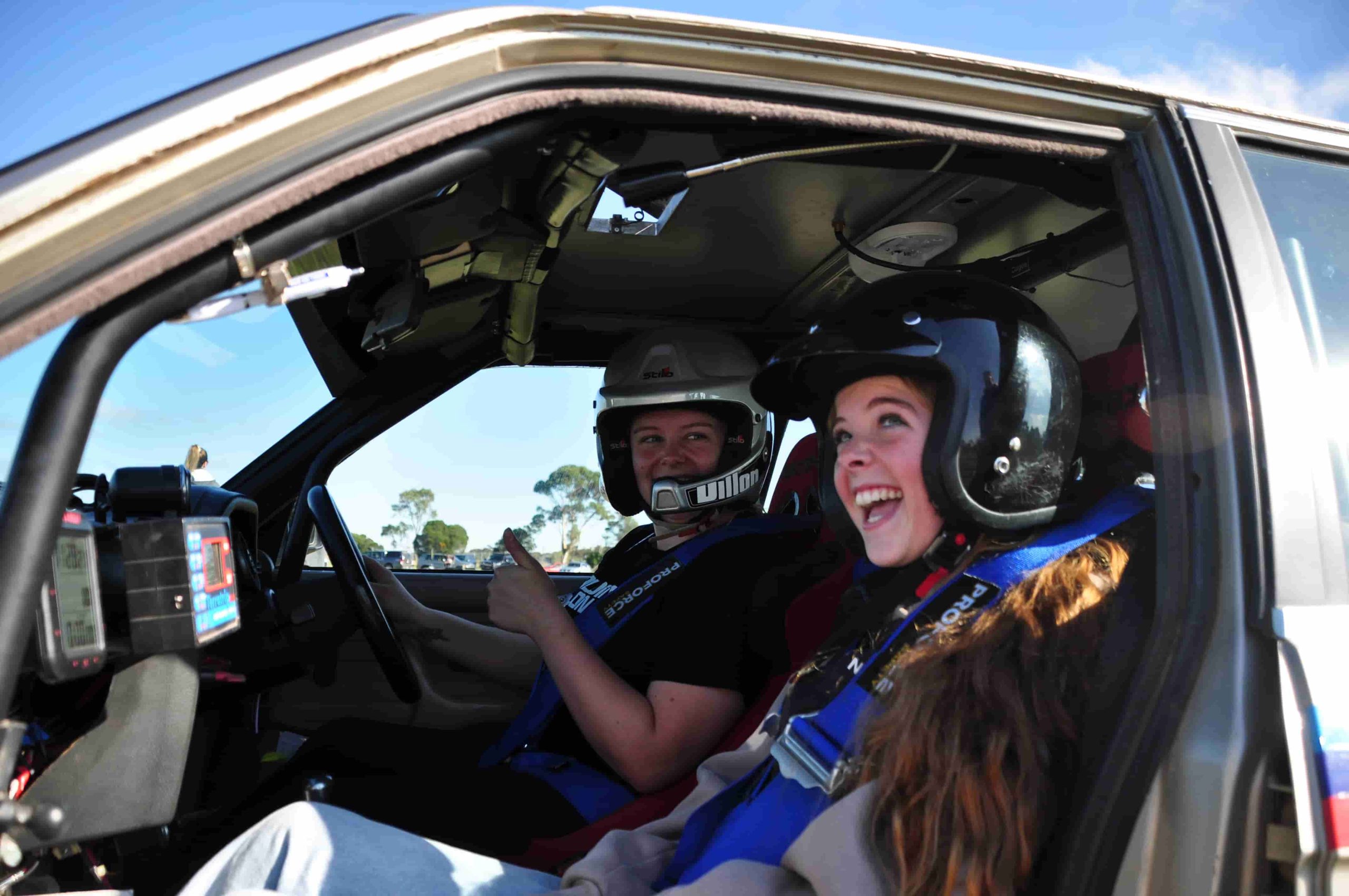 Molly taking the WIM participants on hot laps on the autocross track at Avalon